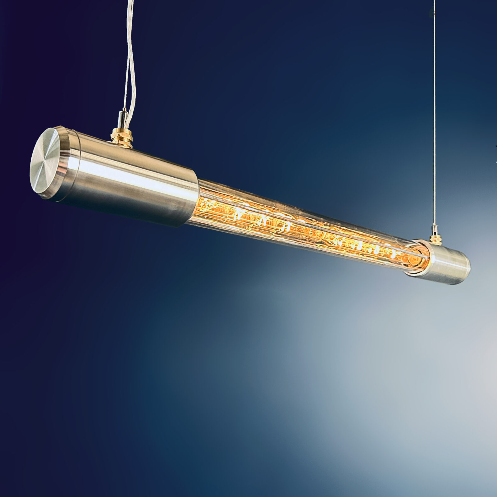 Shop for a industrial style linear ceiling light, installed with Edison LED filament tubes. British designed and made. Manufactured with high quality materials aluminium and glass.