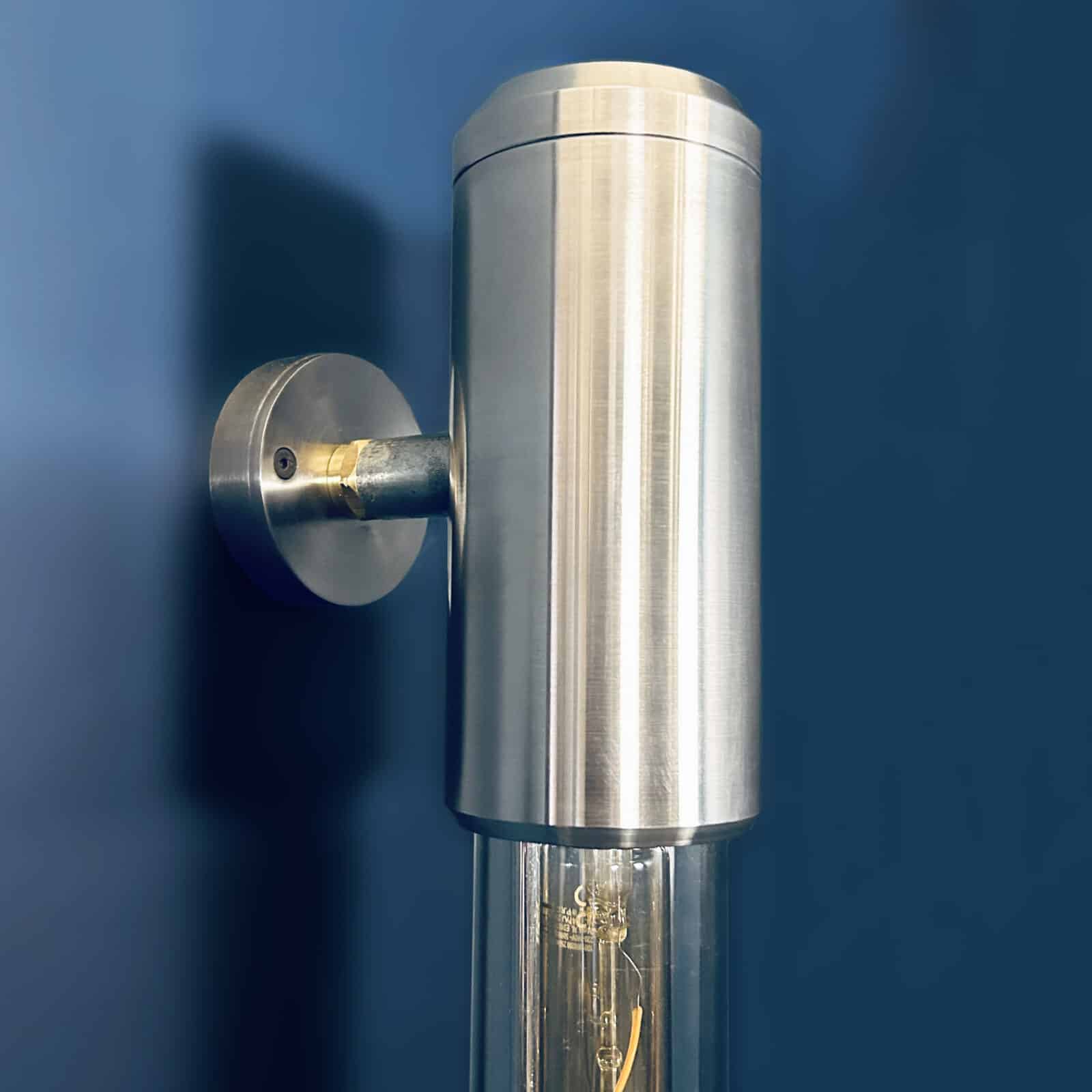 Aluminium and glass long wall lights designed and made in England fitted with Edison LED filament tubes. A modern industrial long wall light.