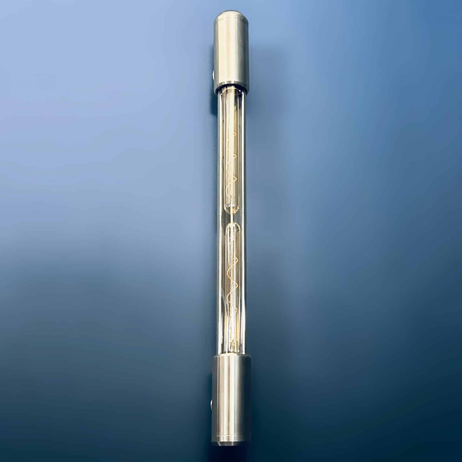 Aluminium and glass long wall lights designed and made in England fitted with Edison LED filament tubes. A modern industrial long wall light.