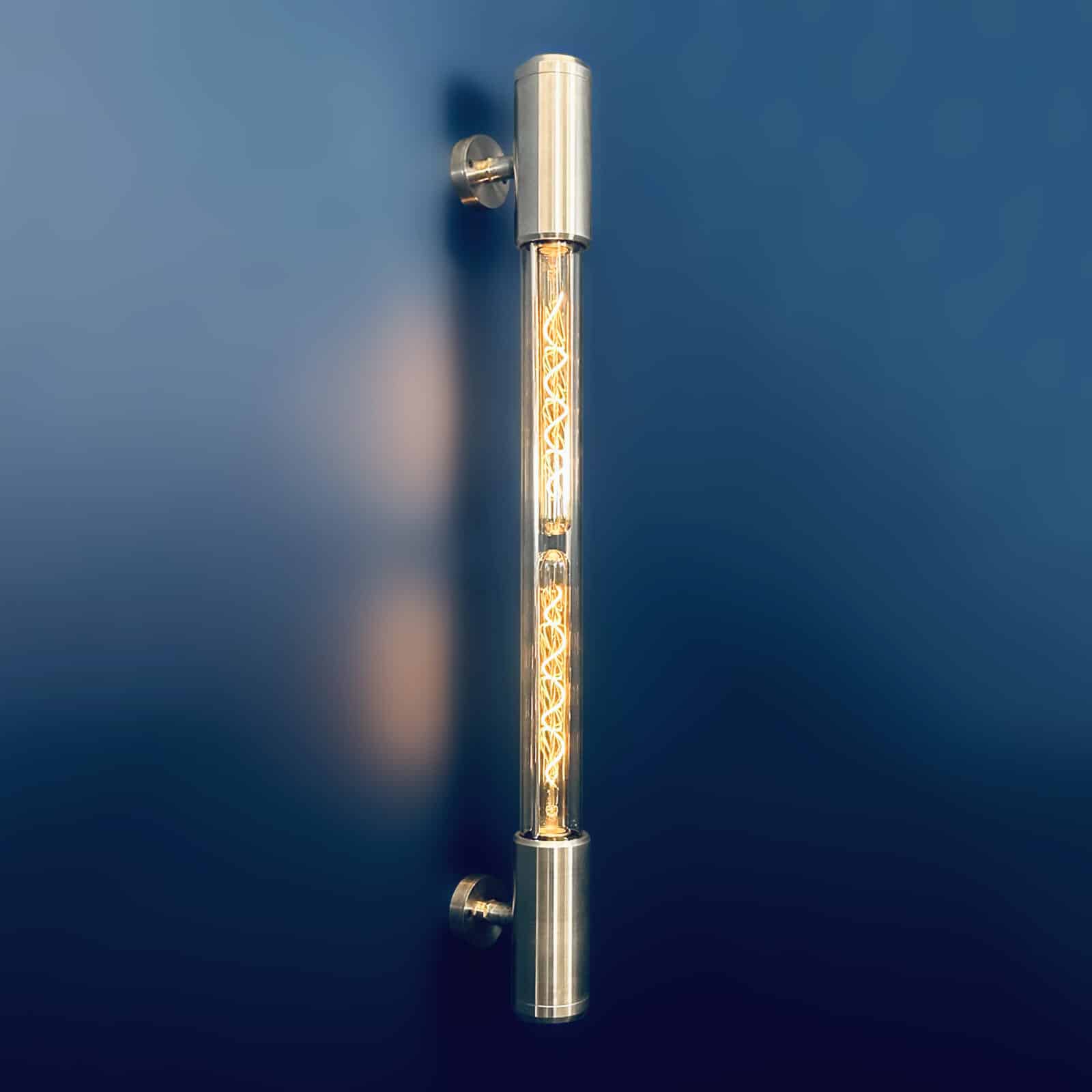 Aluminium and glass long wall lights designed and made in England fitted with Edison LED filament tubes. A modern industrial long wall light.
