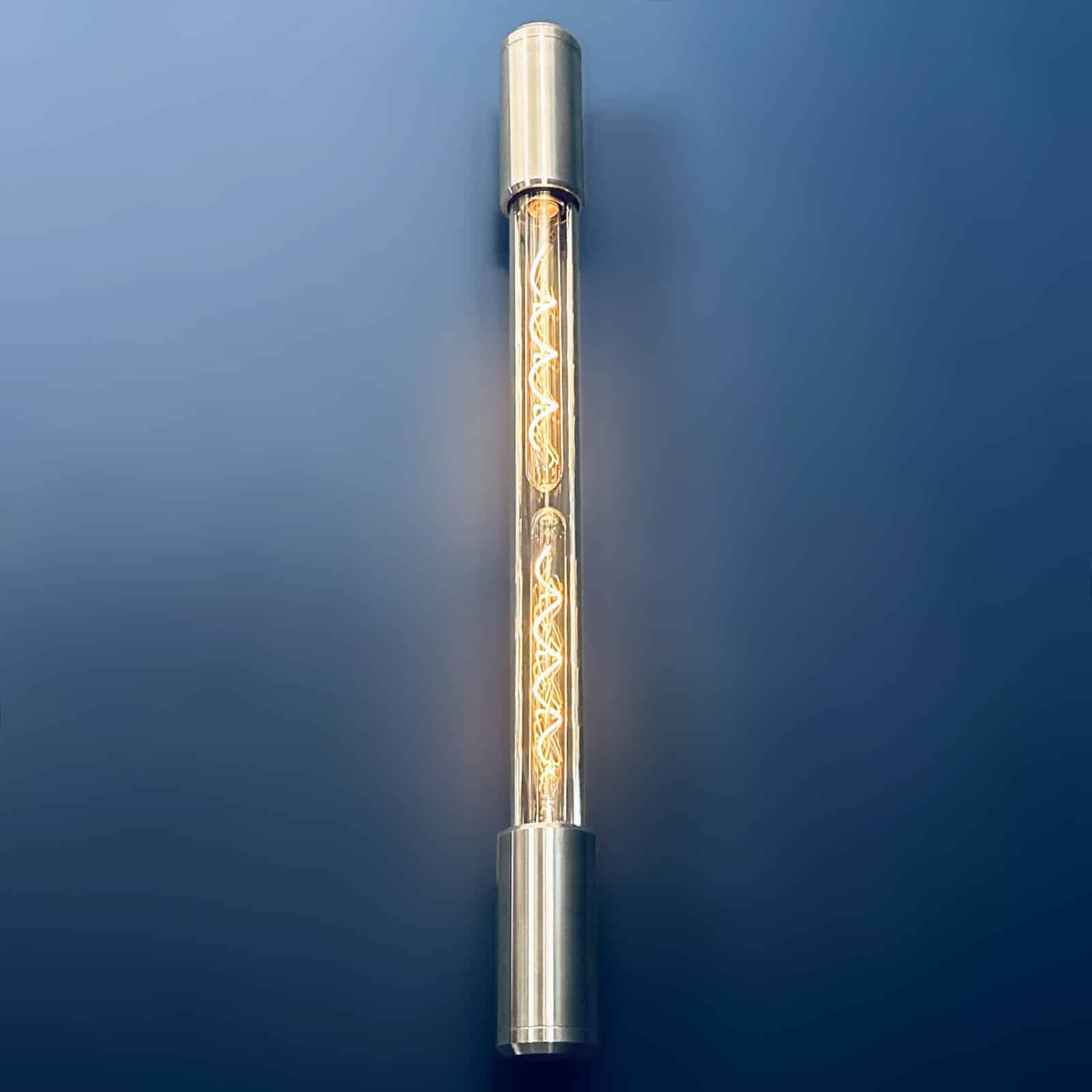 Aluminium and glass long wall lights designed and made in England fitted with Edison LED filament tubes. A modern industrial long wall light.