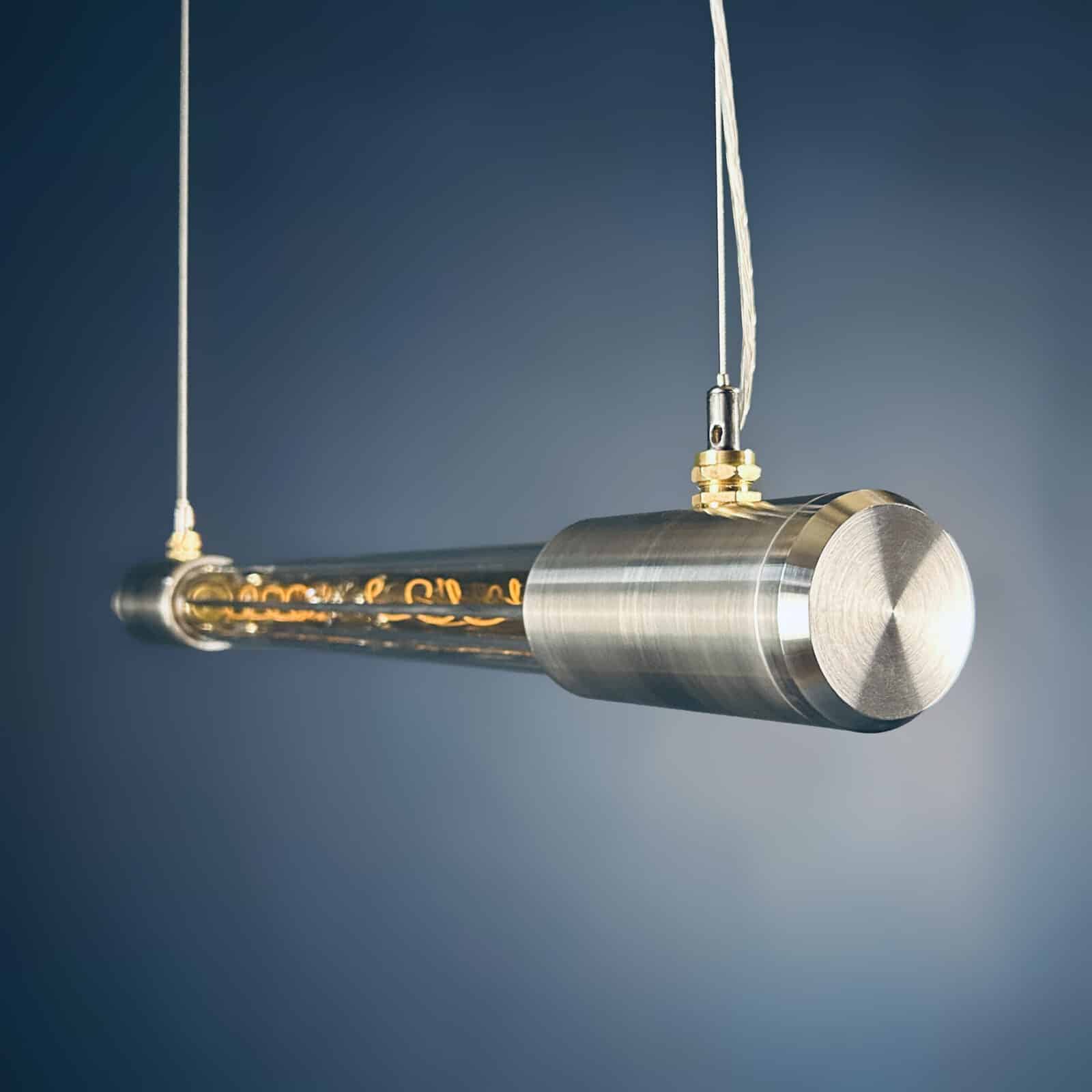 Shop for a industrial style linear ceiling light, installed with Edison LED filament tubes. British designed and made. Manufactured with high quality materials aluminium and glass.
